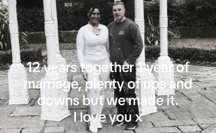 a man and a woman standing in front of a white gazebo