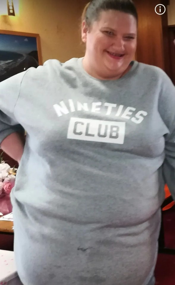 a woman is wearing a nineties club shirt