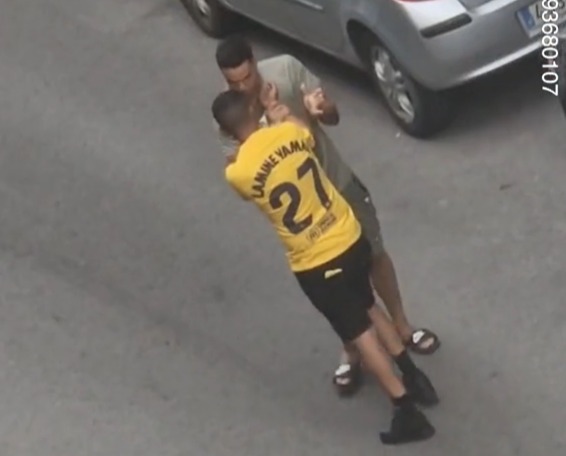 a man wearing a yellow shirt with the number 27 on it