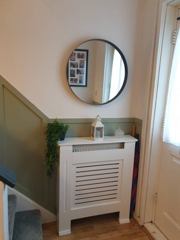 To complete the transformation, Lisa attached a round mirror, as well as a radiator cover she'd nabbed from eBay