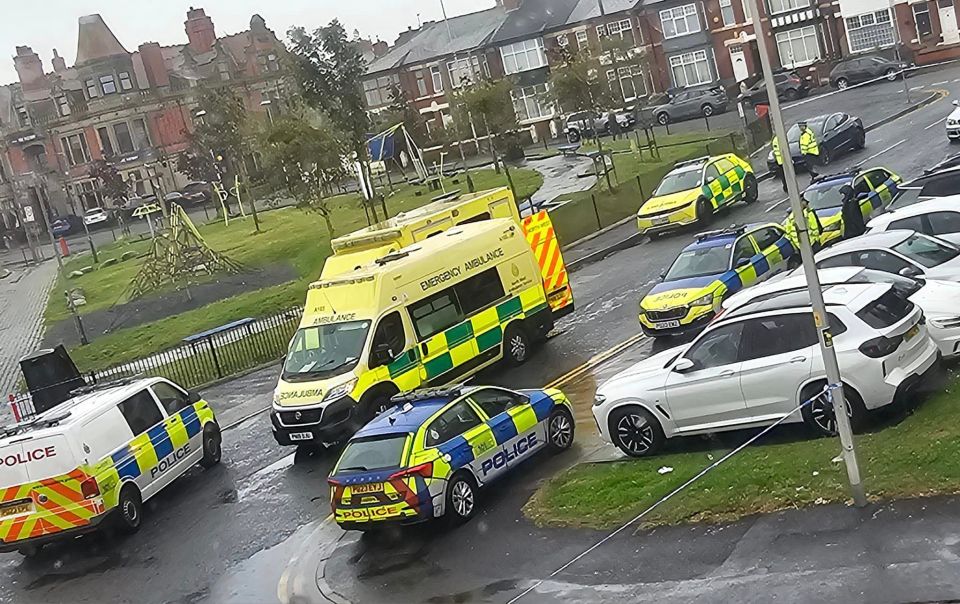 a police car is parked next to an ambulance