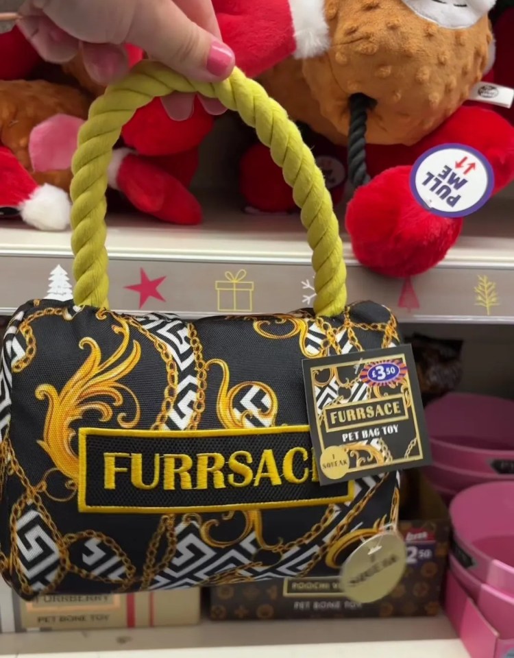 a furrsac dog toy with a yellow handle