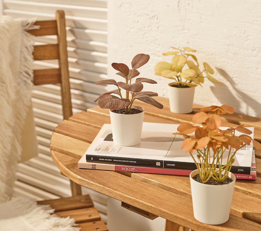 a stack of books on a wooden table including one called knick