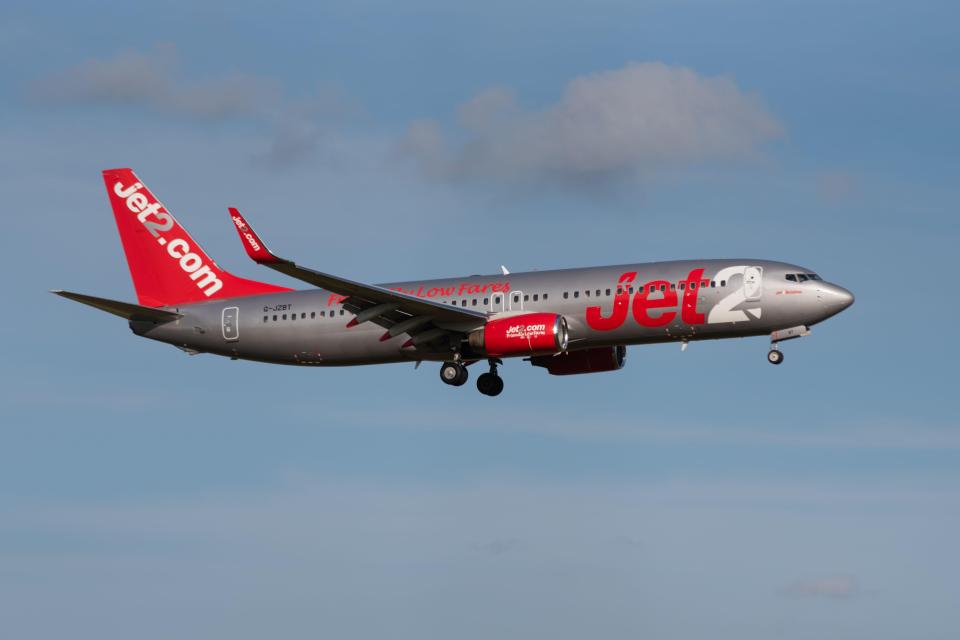 a jet2 plane is flying in the sky