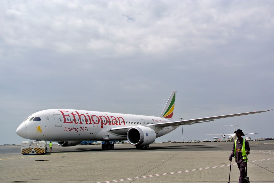 an ethiopian boeing 787 is parked on the runway