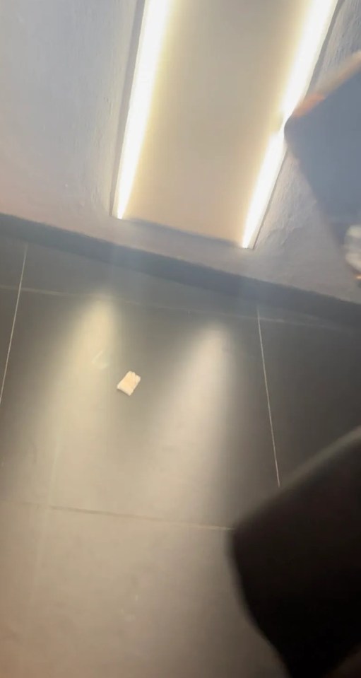 The suspicious looking bag of white powder was discarded on the floor