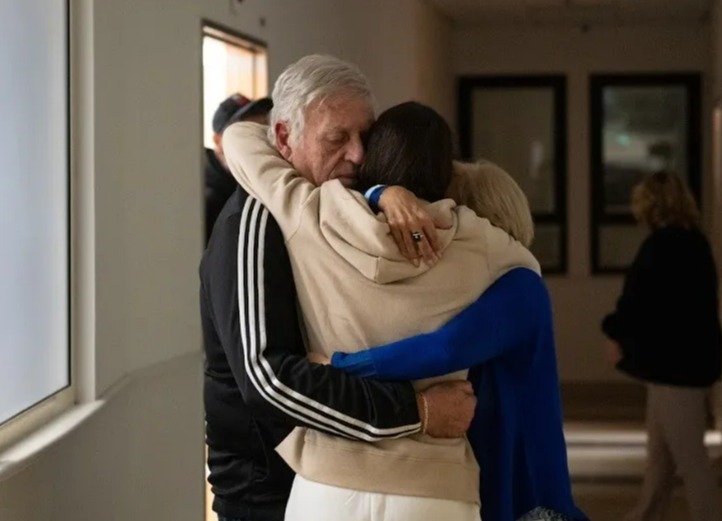 Moran hugging her family after being reunited with them last November