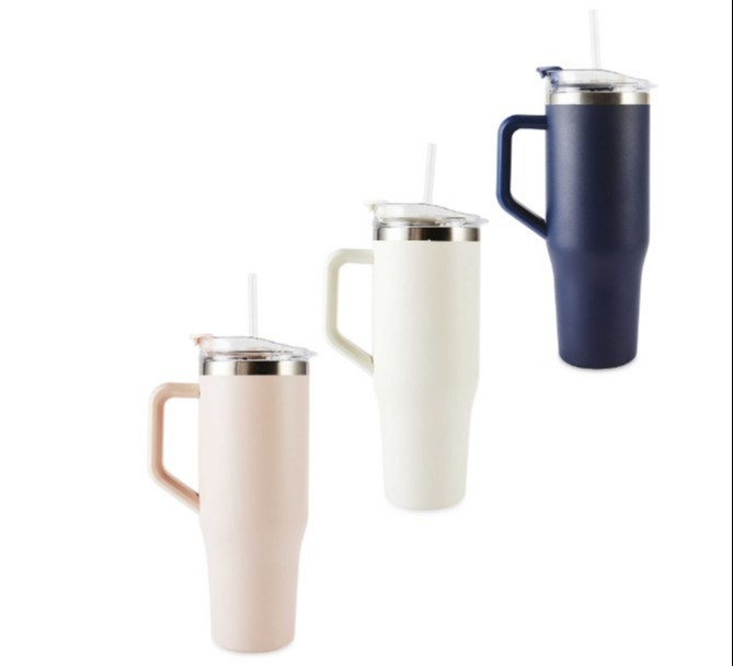 three different colored mugs with straws and handles