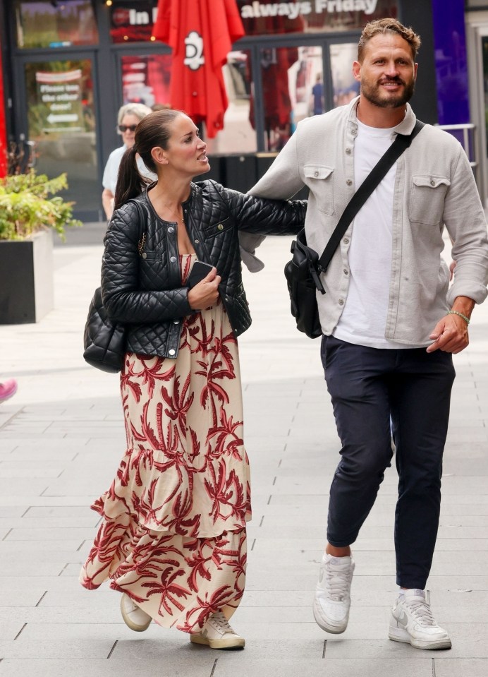 a man and woman are walking down a sidewalk in front of a restaurant called always friday