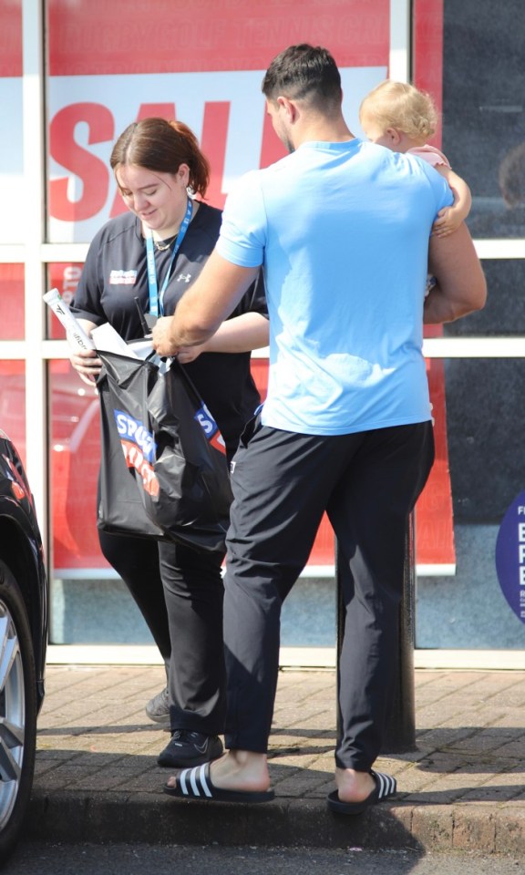 A member of staff followed the boxer out of the store and asked to see his bag