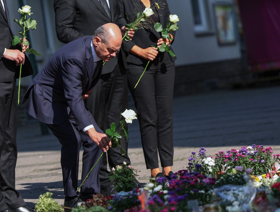 He laid down a flower at a makeshift memorial