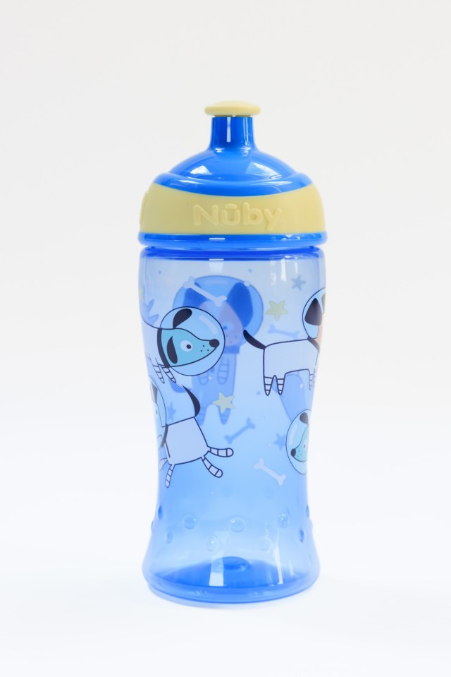 a blue noby cup with dogs on it