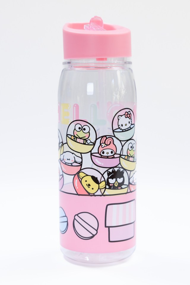 a bottle with a pink lid and a hello kitty design on it