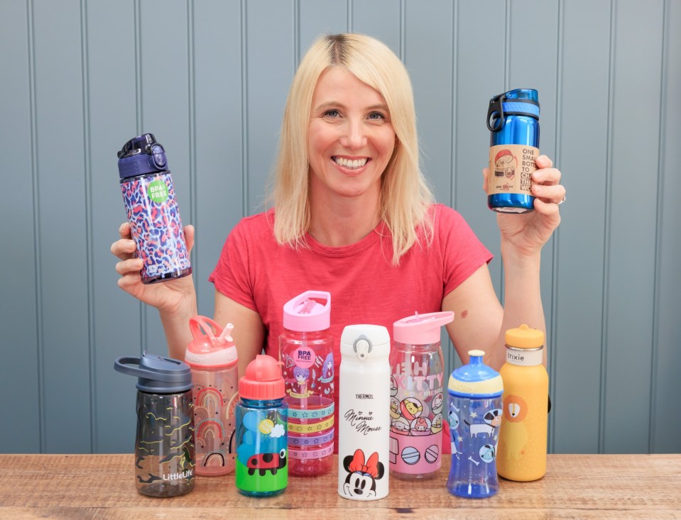 a woman holding a thermos water bottle with minnie mouse on it