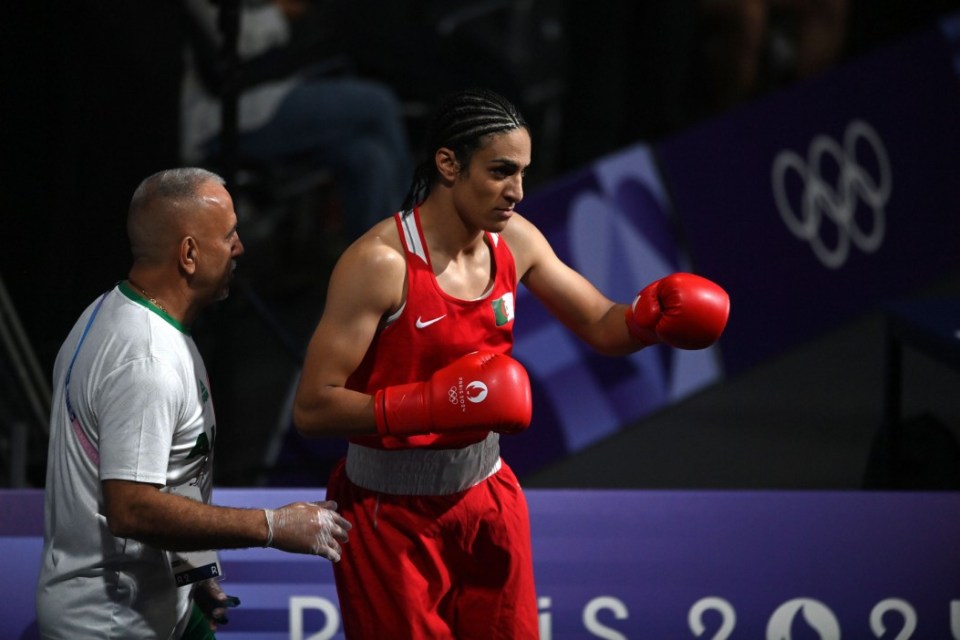 PARIS, FRANCE - AUGUST 1: Algeria's Imane Khelif (in red) during the Women's 66kg preliminary round match against Angela Carini of Italy (not seen) on day six of the Olympic Games Paris 2024 at North Paris Arena on August 01, 2024 in Paris, France. (Photo by Fabio Bozzani/Anadolu via Getty Images)