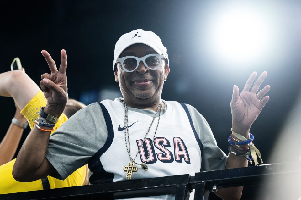 Moviemaker Spike Lee poses for the camera while watching from the stands