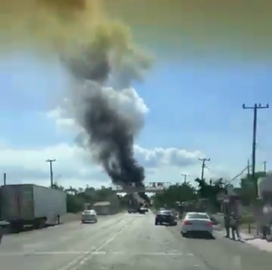 Black smoke is seen billowing in the skies