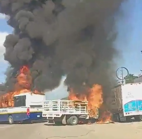 Vehicles burn in what appear attempts to block the authorities