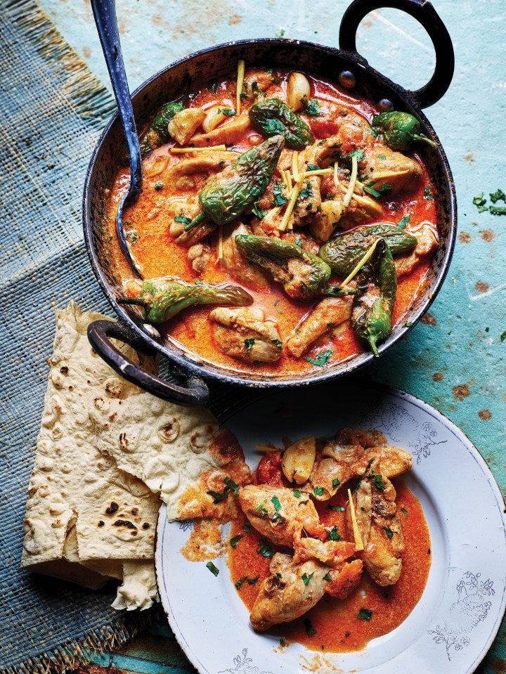 a bowl of chicken curry next to a plate of chicken curry