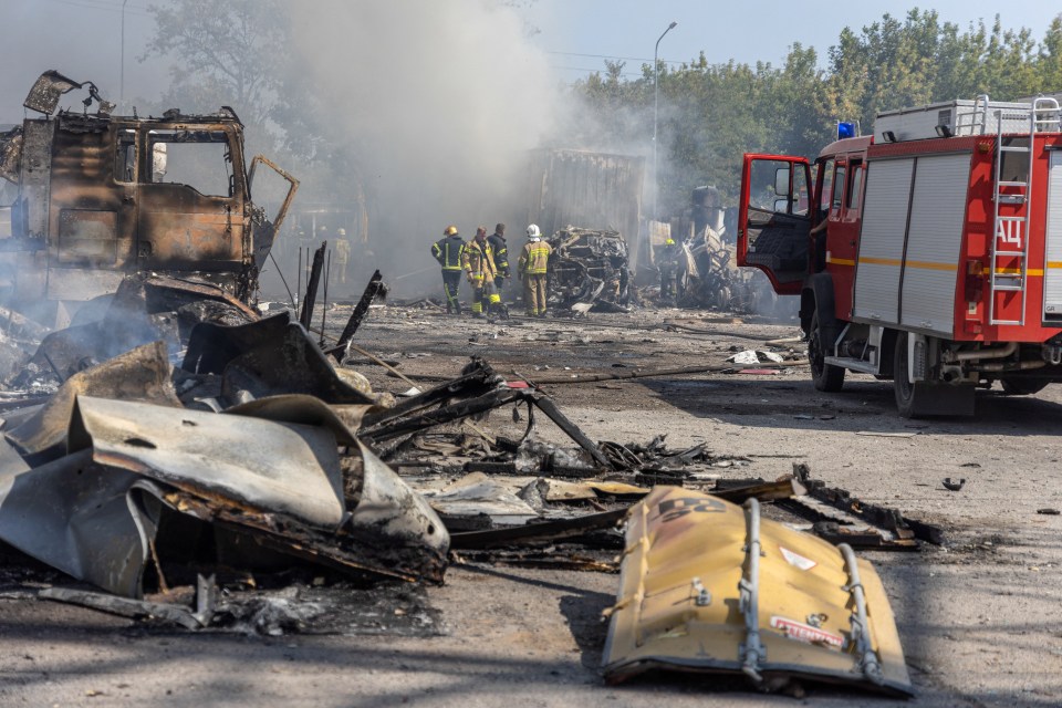 Ukrainian firefighters extinguish a fire on a site following an air attack, in the Odesa region, on August 26, 2024, amid the Russian invasion of Ukraine. Russian drones and missiles on August 26, 2024 targeted 15 regions across Ukraine in an overnight barrage aimed mainly at energy infrastructure, Ukrainian Prime Minister Denys Shmygal said. (Photo by Oleksandr GIMANOV / AFP) (Photo by OLEKSANDR GIMANOV/AFP via Getty Images)