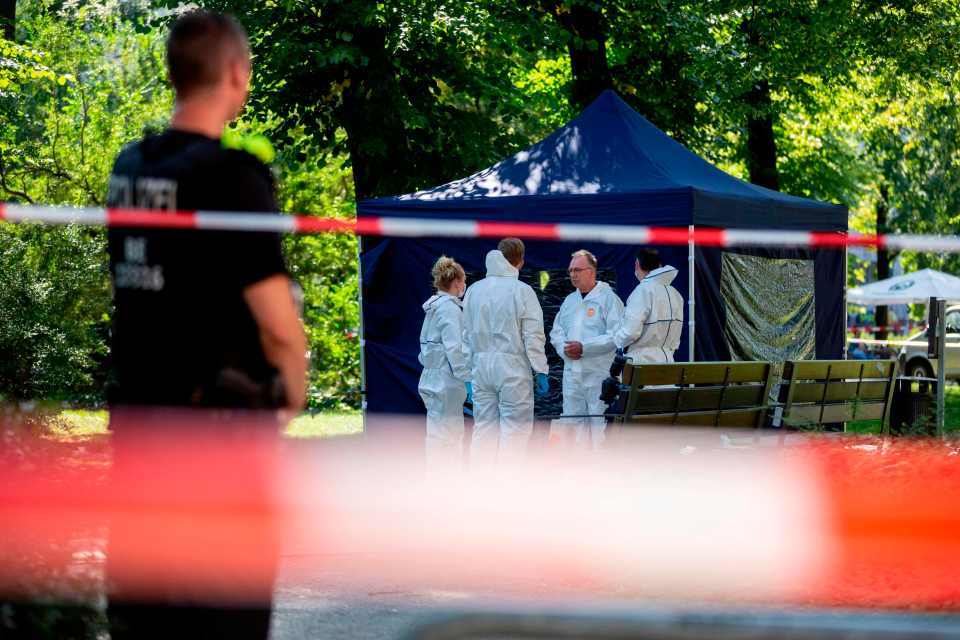 (FILES) This file photo taken on August 23, 2019 shows forensic experts of the police securing evidences at the site of a crime scene in Berlin's Moabit district, where a man of Georgian origin was shot dead. - German prosecutors in charge of intelligence cases are due to take over the investigation into the killing of the former Chechen rebel commander, the 40-year-old Georgian national Zelimkhan Khangoshvili, by a Russian national in Berlin's Kleiner Tiergarten park on August 23, as German media reported on December 3, 2019. (Photo by Christoph Soeder / dpa / AFP) / Germany OUT (Photo by CHRISTOPH SOEDER/dpa/AFP via Getty Images)