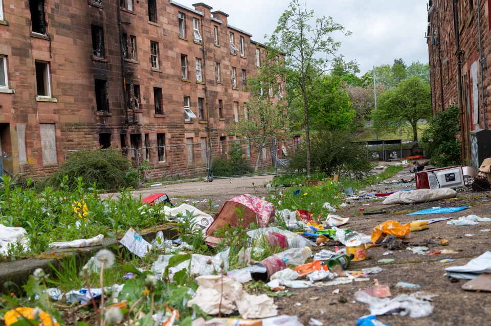 A derelict estate in Glasgow is in desperate need of demolition but residents won't budge