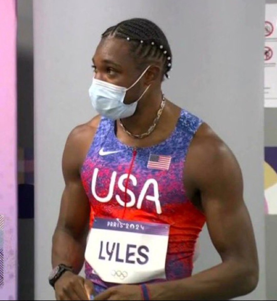 Lyles was also was seen in a mask before the race