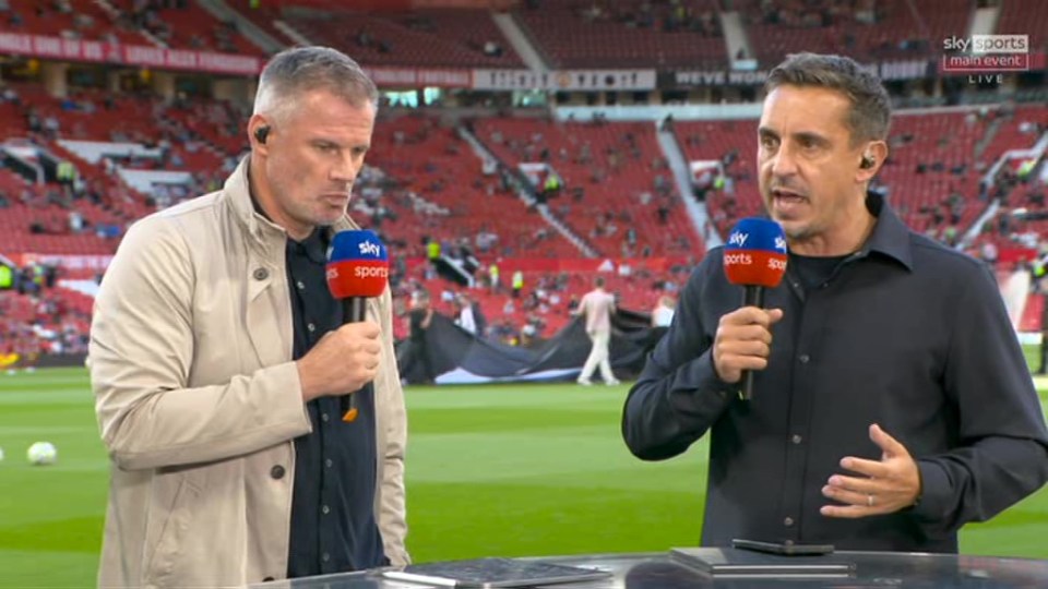 two men on a soccer field with microphones that say sky sports