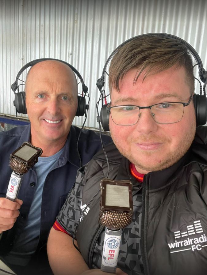 two men wearing headphones and holding wirralradio microphones