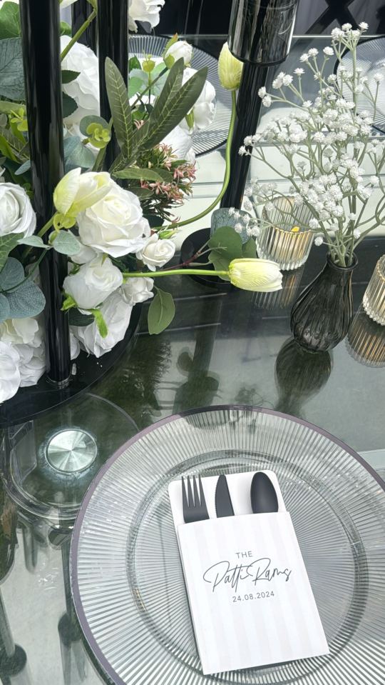 a place setting with a napkin that says the patty pans