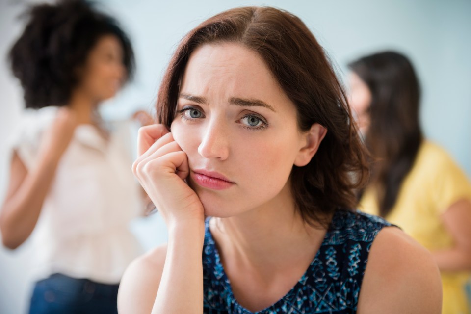 a woman with a sad look on her face