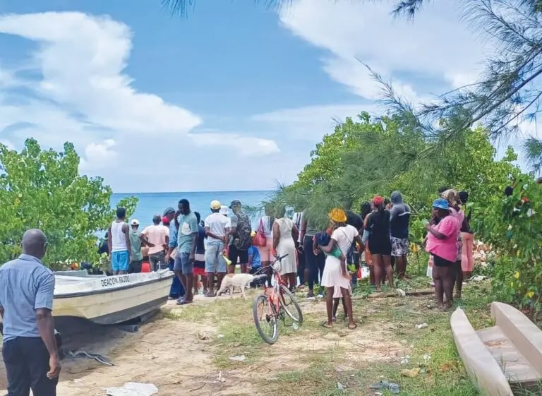 Locals gathered around Montego Bay as the teen's body was recovered on Tuesday