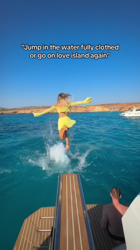 The loved-up pair didn't care about their clothes as they jumped into the sea