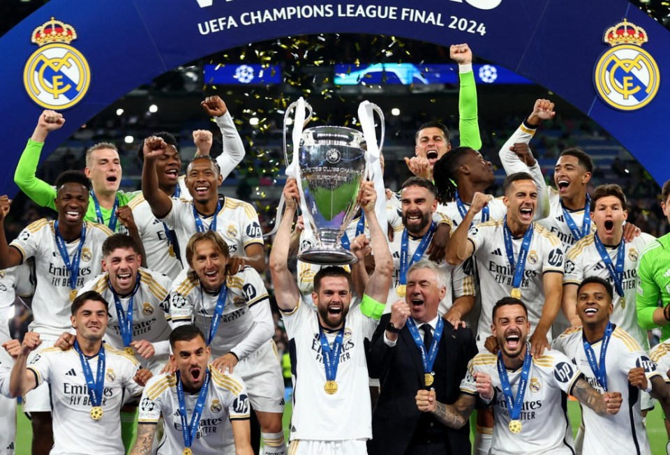 Soccer Football - Champions League - Final - Borussia Dortmund v Real Madrid - Wembley Stadium, London, Britain - June 1, 2024 Real Madrid's Nacho lifts the trophy as they celebrate winning the Champions League REUTERS/Carl Recine