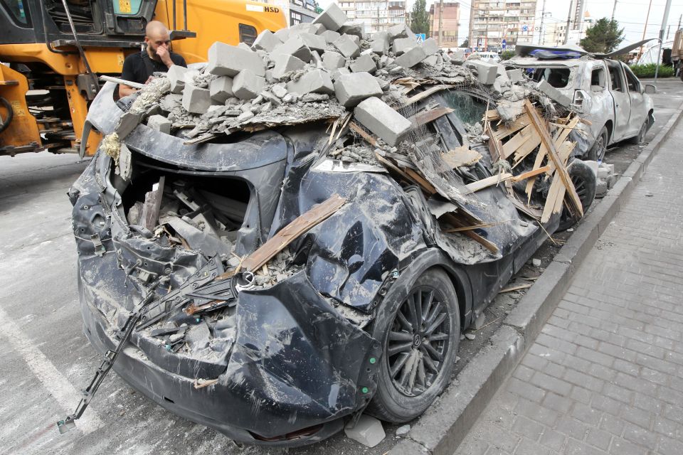 A crushed car seen near the hotel destroyed by the Russian ballistic missile attack