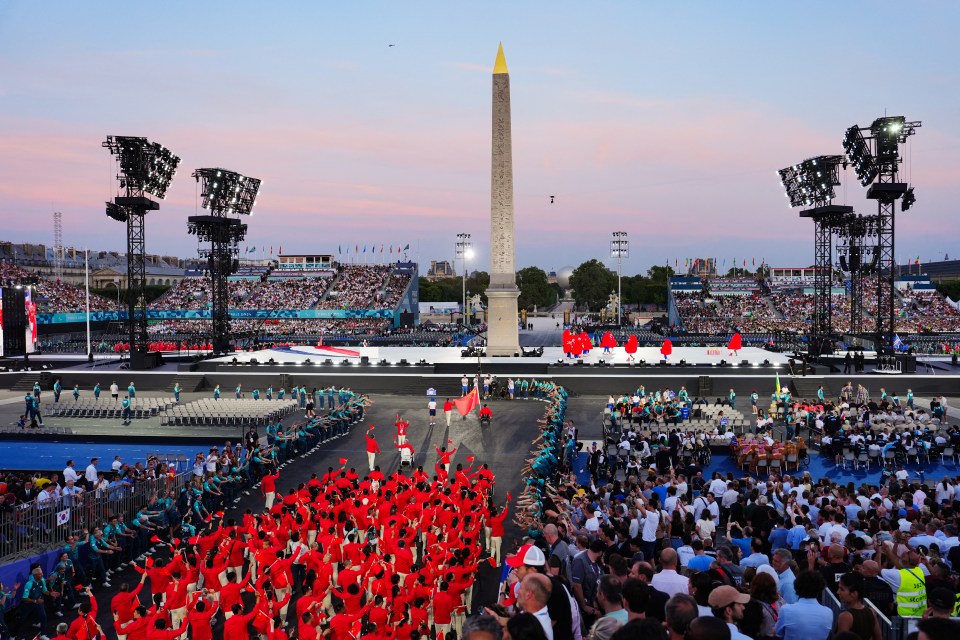 Athletes from China's delegation arrive in front of the Obelisque de Louxor (Luxor Obelisk) at the Place de la Concorde during the Paris 2024 Paralympic Games Opening Ceremony in Paris on August 28, 2024. (Photo by Dimitar DILKOFF / AFP) (Photo by DIMITAR DILKOFF/AFP via Getty Images)