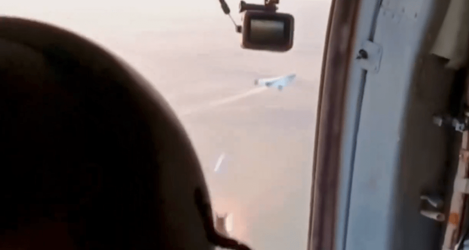 a plane is flying in the sky with a camera attached to it