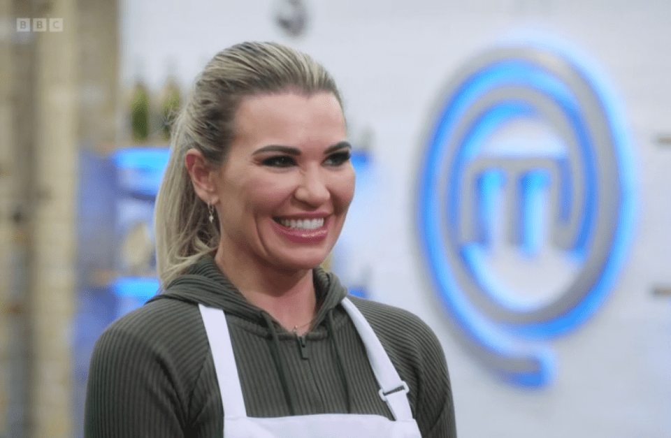 a woman is smiling in front of a bbc logo