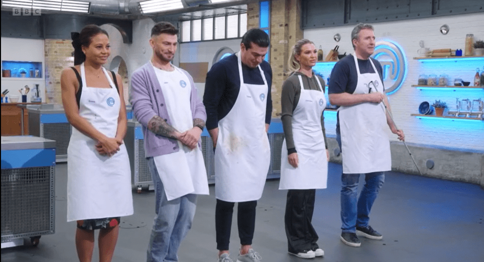 a group of people wearing aprons with the bbc logo on them