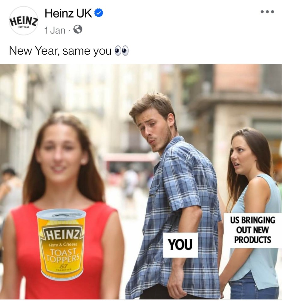 a man and a woman are looking at a can of heinz toast toppers