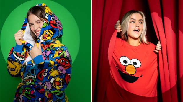 a woman in a sesame street hoodie and elmo shirt