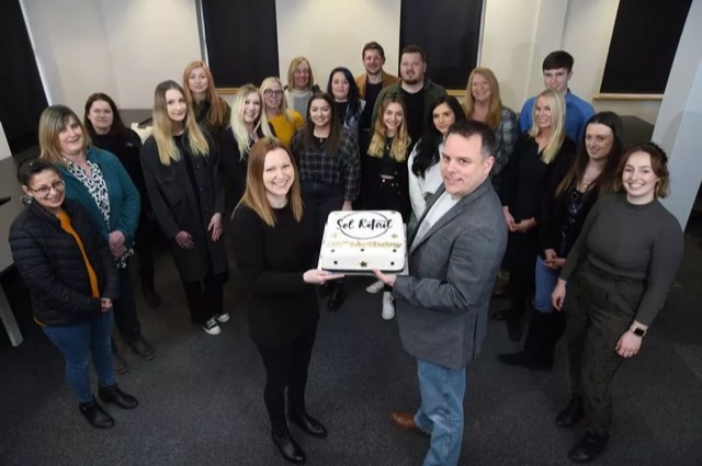 Kate and Barry with their employees celebrating the first birthday of Sol