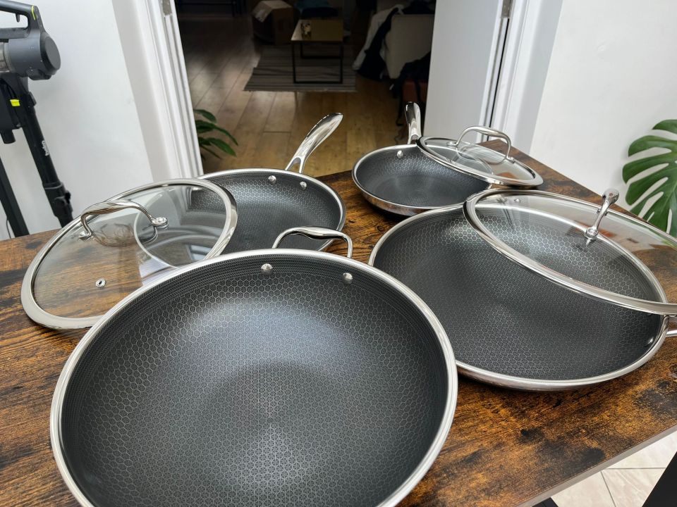 The 13 piece set includes three frying pans in differing sizes and a wok, as well as three saucepans