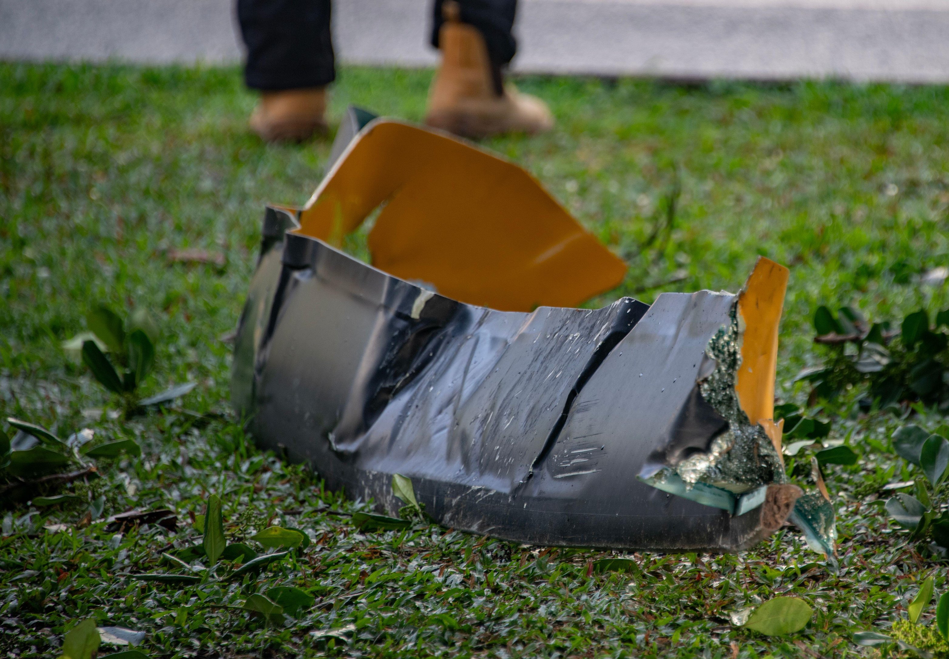 Debris from a helicopter is seen after it crashed into the roof of the Double Tree by Hilton Hotel