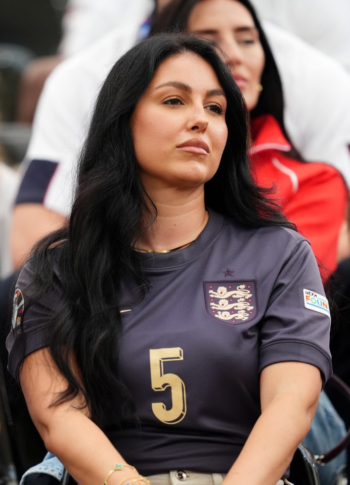 a woman wearing a shirt with the number 5 on it