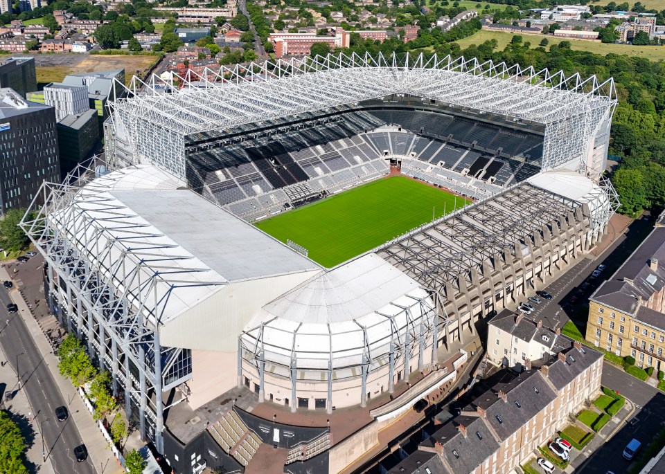 an aerial view of a soccer stadium with a white roof