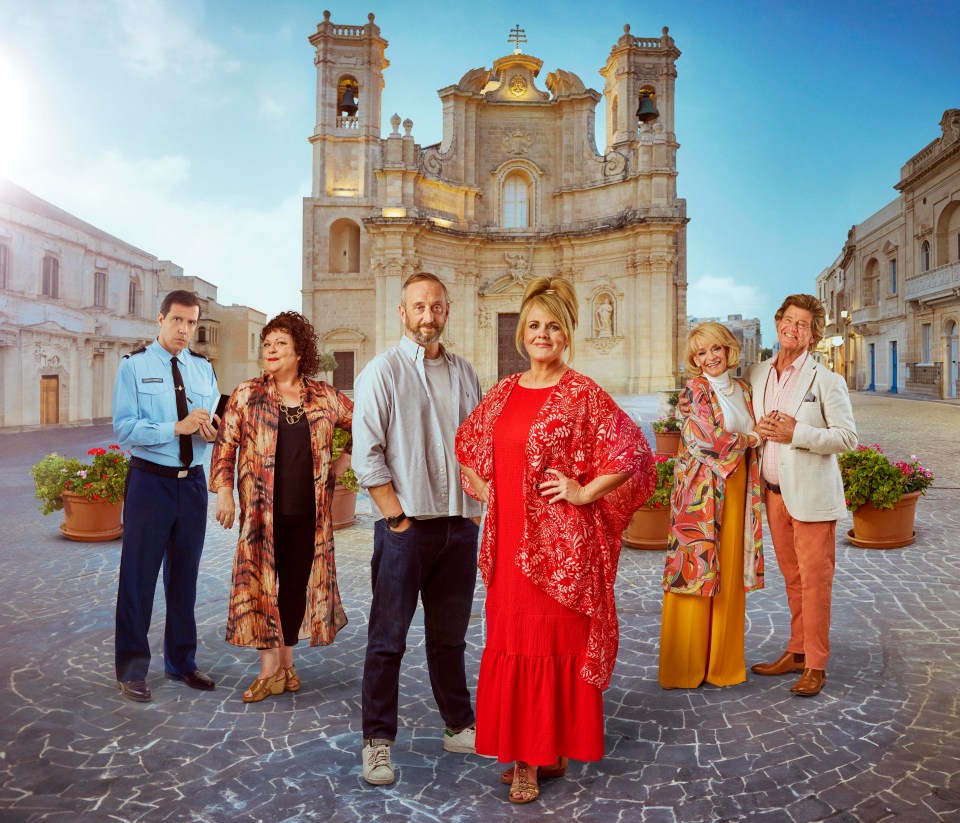 a group of people standing in front of a church