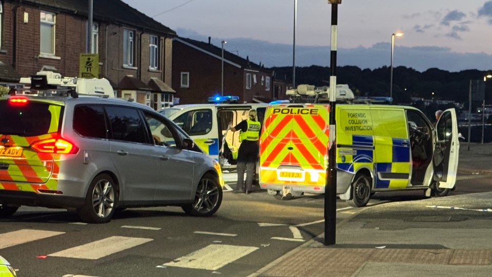 a police van is parked on the side of the road