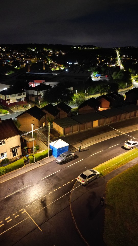 an aerial view of a residential area at night