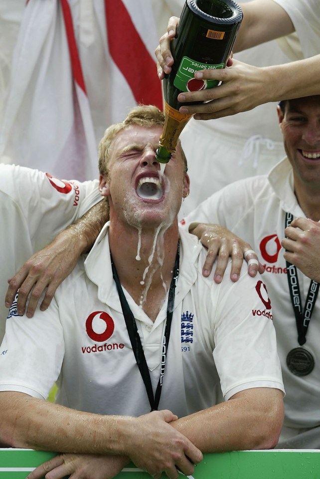 a man in a vodafone shirt is pouring champagne into his mouth